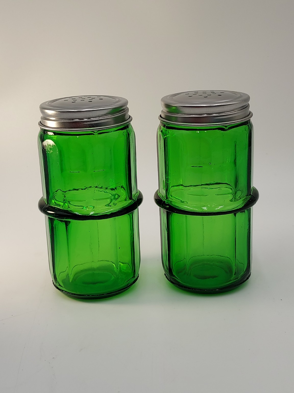 Pair of green glass vintage shakers